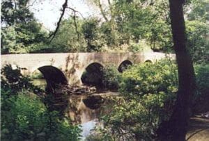 Four Arches bridge at the end of the Dingles on the River Cole